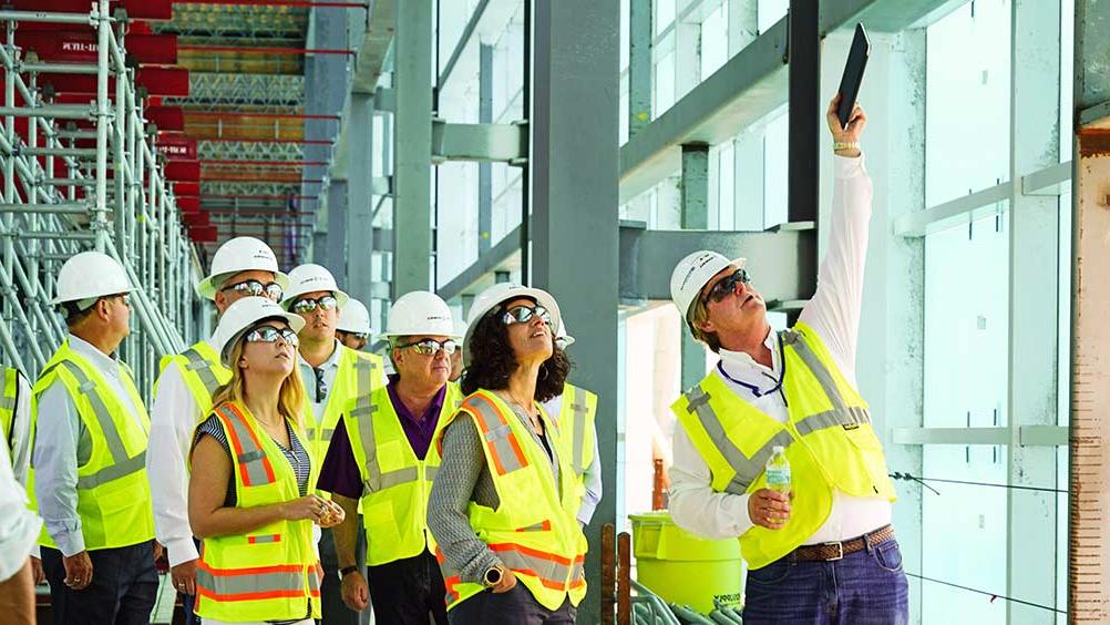 People touring a construction site.